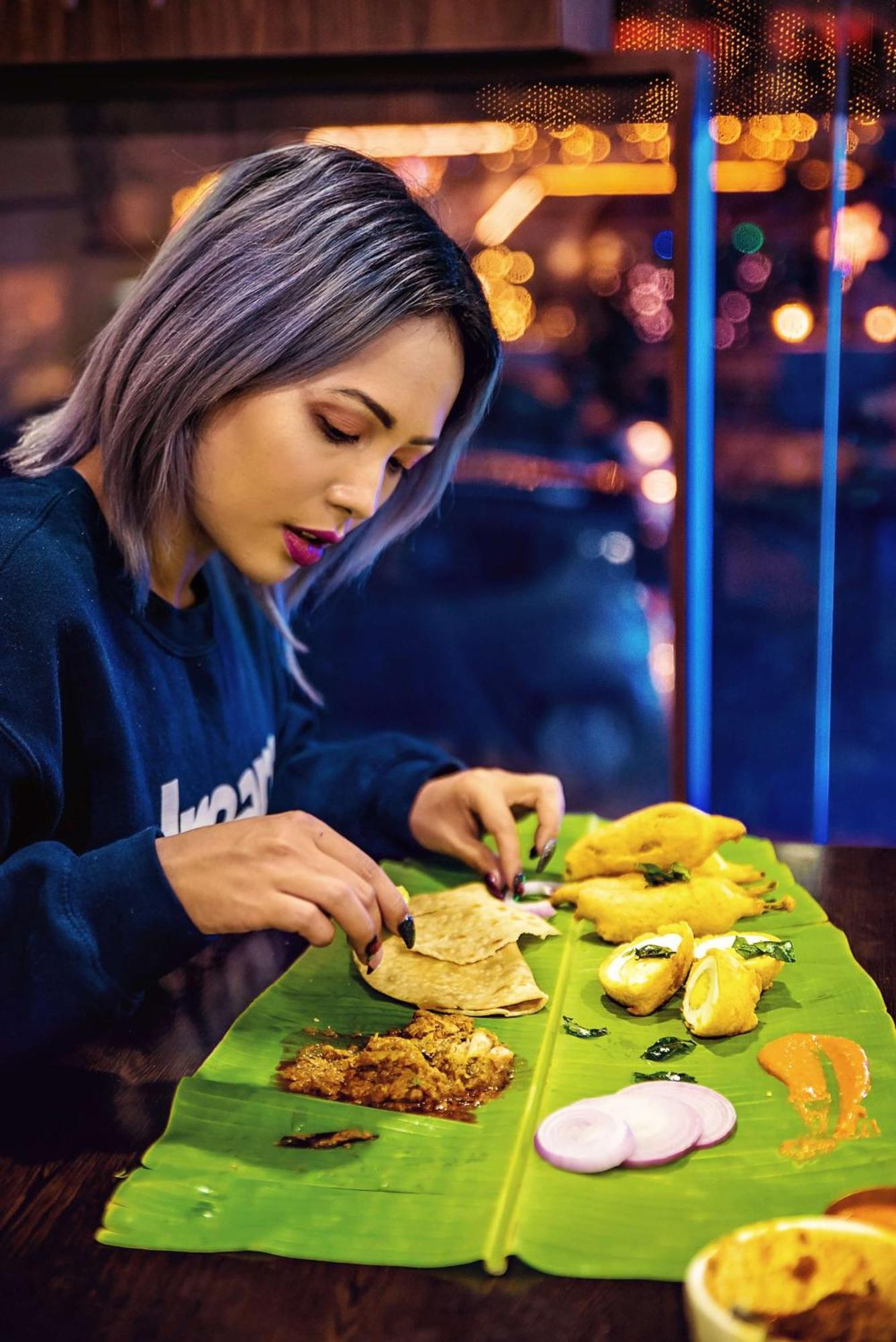 Hyatt Centric Mg Road Bangalore Exterior photo A woman preparing food