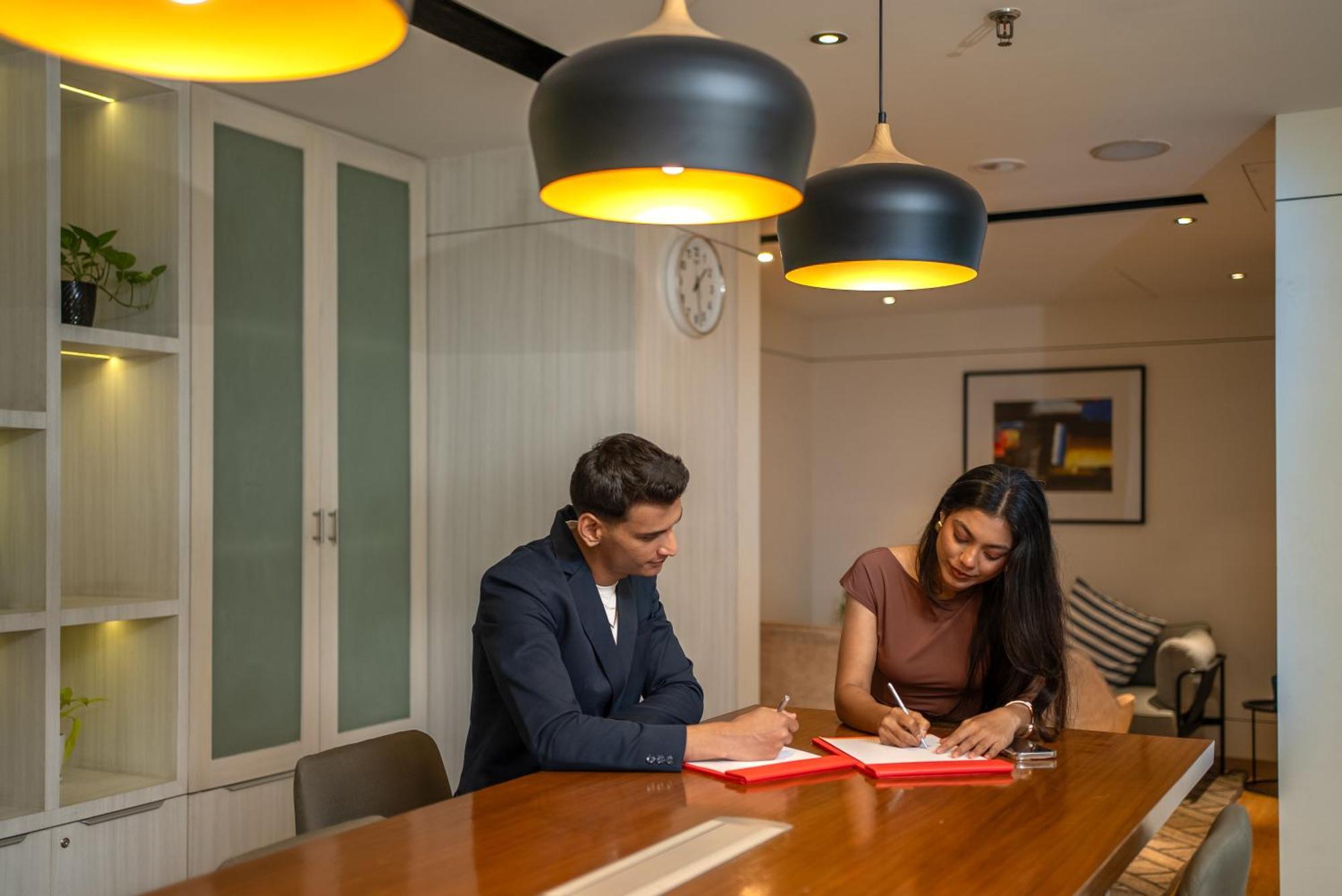 Hyatt Centric Mg Road Bangalore Exterior photo A meeting in progress at the office of a law firm in India